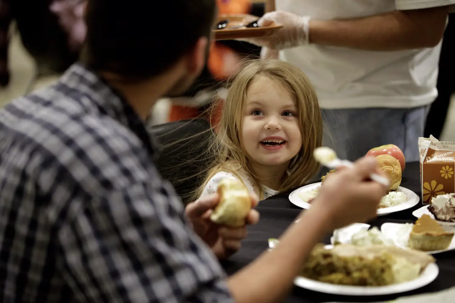 Couple eating at Feast of Giving - Dayton Daily News Photo