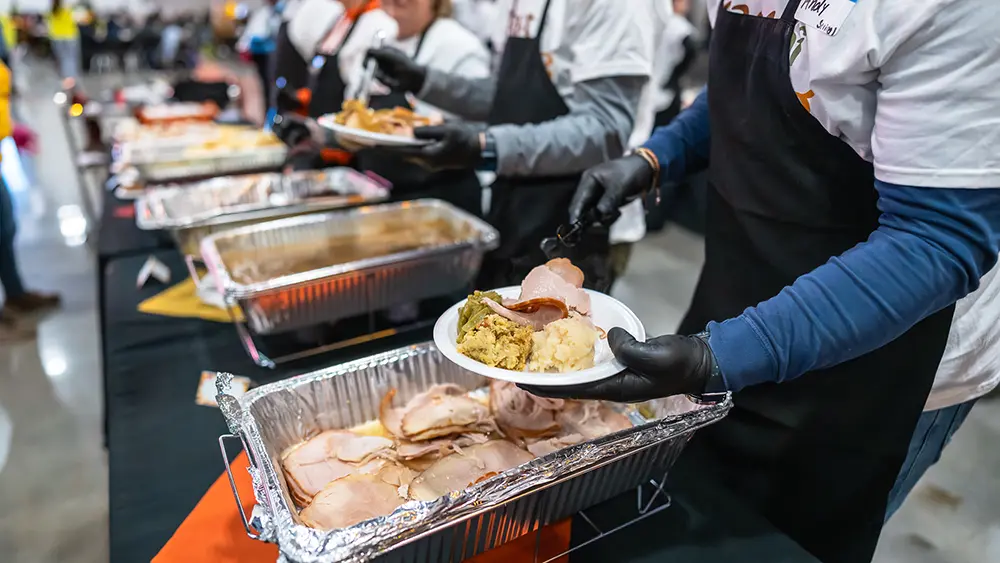 Plate of Thanksgiving food being assembled
